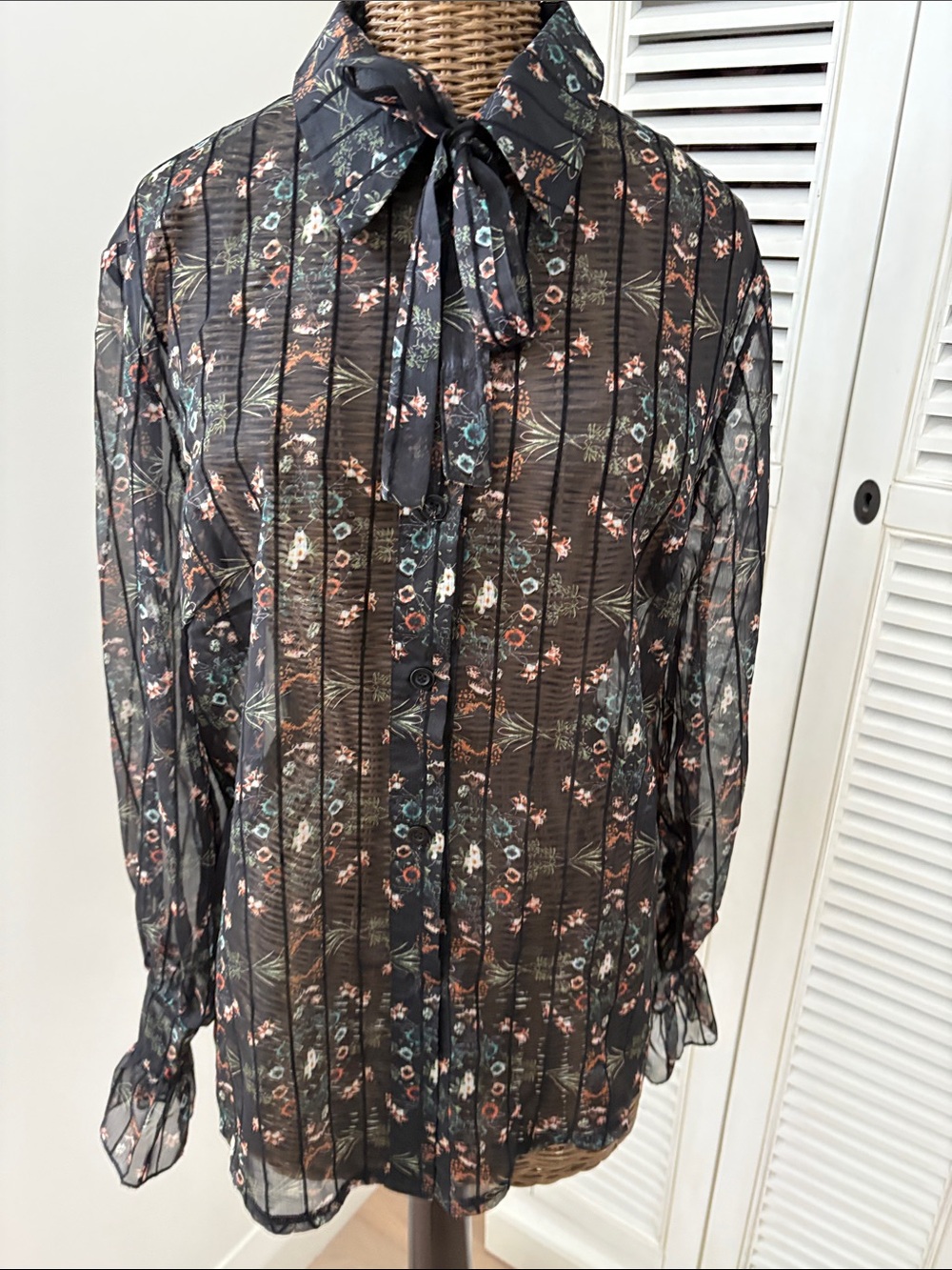 Sheer Black Floral Tie-Neck Shirt with stripe detailing and Ruffle Sleeve